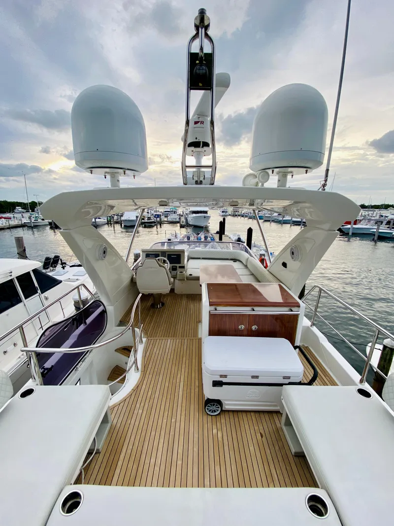 Slide: The Image of 2015 Azimut 50 yacht with spacious deck, docked at marina. - 11