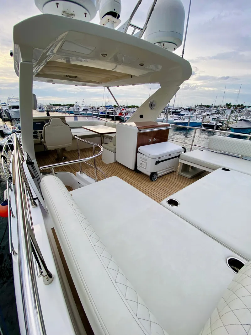 Slide: The Image of Luxurious 2015 Azimut 50 yacht with spacious deck and marina view. - 12