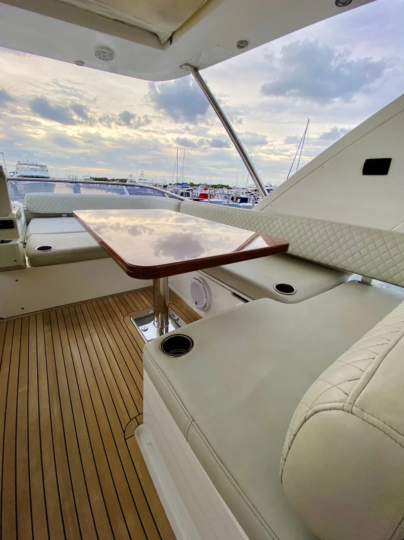 Slide: The Image of Luxurious 2015 Azimut 50 yacht interior with elegant seating and wooden deck. - 23