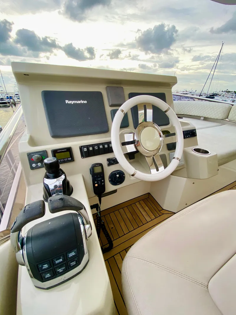 Slide: The Image of Azimut 50 yacht helm, 2015 model, featuring modern navigation controls and luxurious seating. - 26