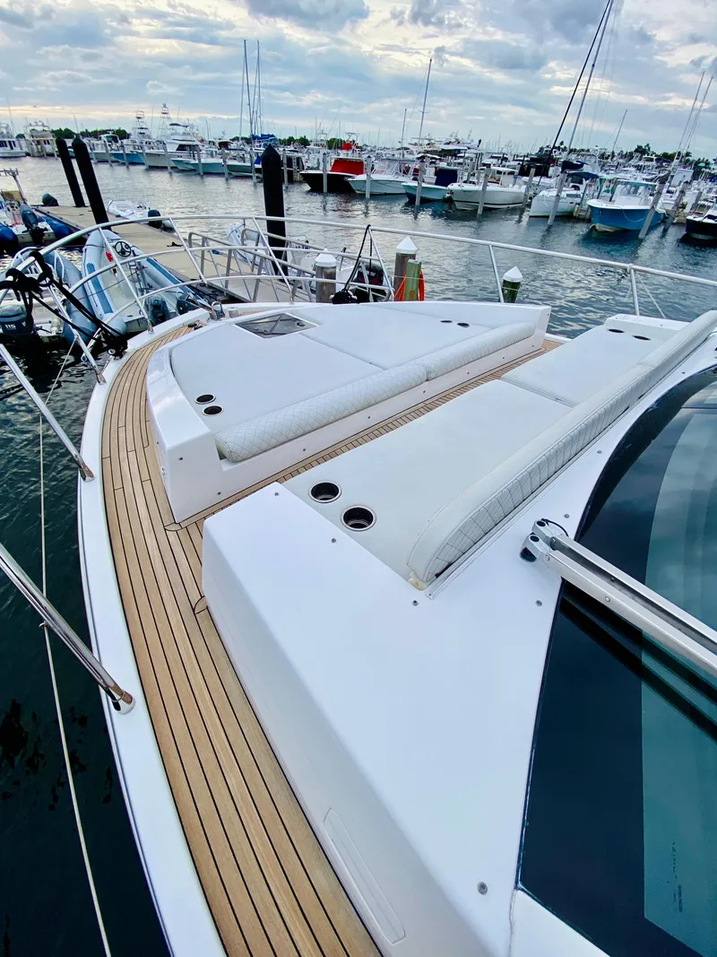 Slide: The Image of 2015 Azimut 50 yacht with sleek deck design, docked at marina. - 31