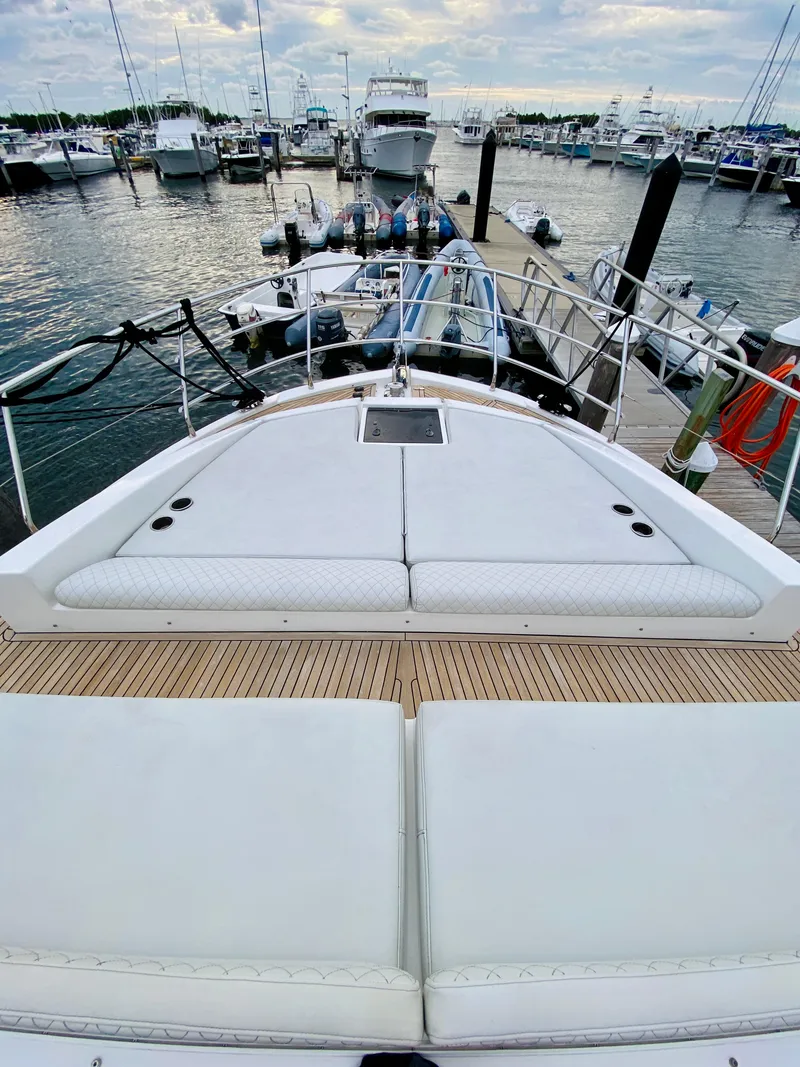 Slide: The Image of Azimut 50 yacht, 2015 model, docked at marina with spacious deck and seating. - 34