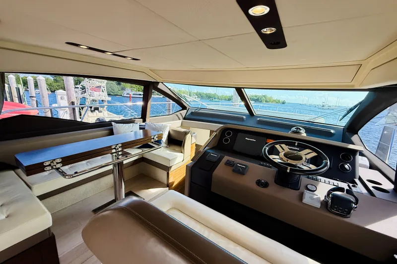 Slide: The Image of Luxurious interior of a 2015 Azimut 50 yacht with helm and seating area. - 38