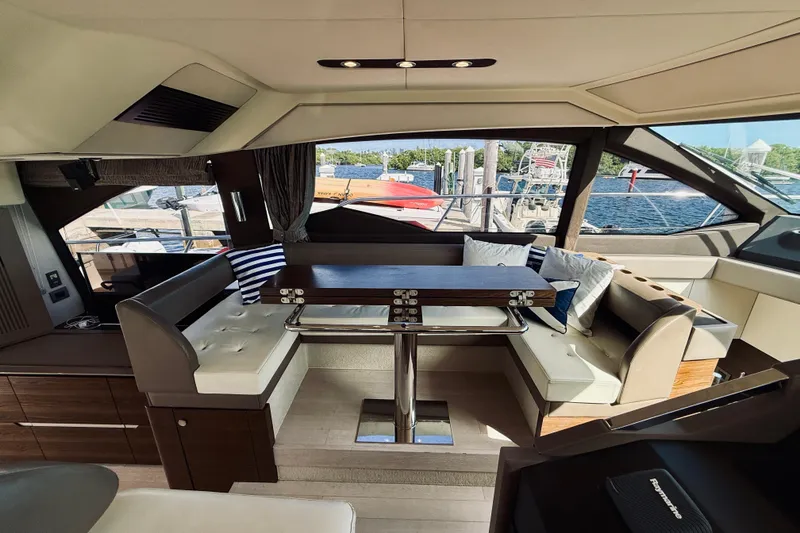 Slide: The Image of Luxurious interior of a 2015 Azimut 50 yacht with elegant seating and dining area. - 41