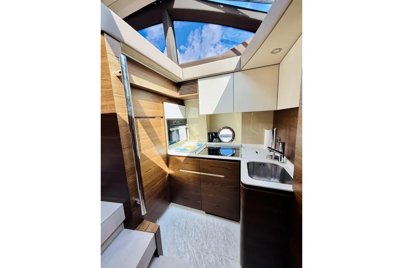 Slide: The Image of Luxurious interior of 2015 Azimut 50 yacht with modern kitchen and skylight. - 47