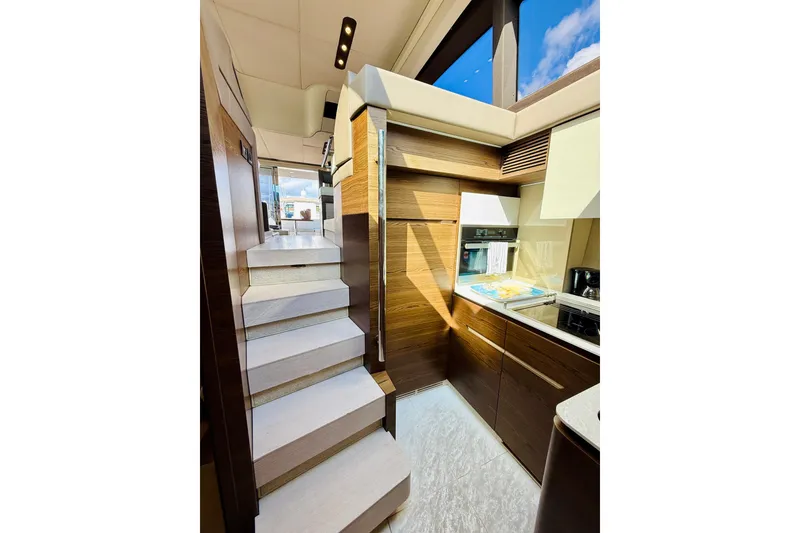Slide: The Image of Luxurious interior of 2015 Azimut 50 yacht with modern kitchen and staircase. - 48