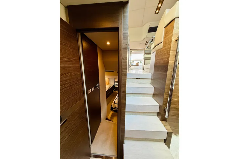 Slide: The Image of Interior view of 2015 Azimut 50 yacht, featuring modern stairs and cabin entrance. - 54