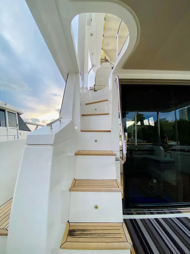 Slide: The Image of Staircase on 2015 Azimut 50 yacht with wooden steps and sleek design. - 9
