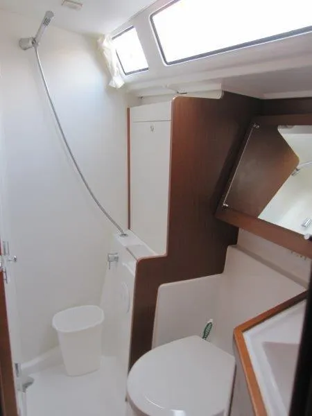 Slide: The Image of 2015 Beneteau Oceanis 45 bathroom with shower, toilet, and mirror. - 14