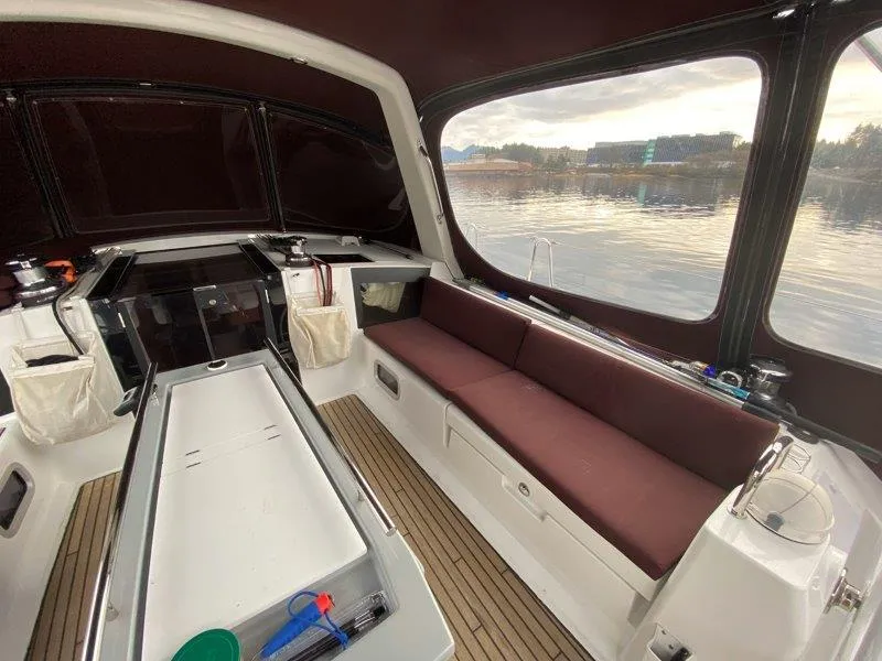 Slide: The Image of 2015 Beneteau Oceanis 45 yacht interior with seating and water view. - 27