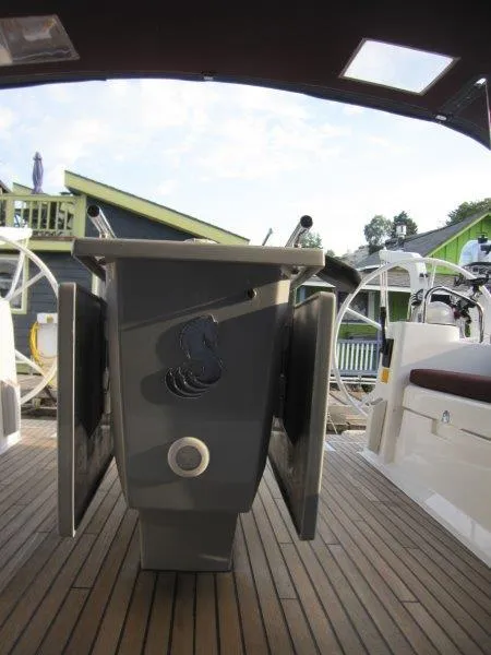 Slide: The Image of Beneteau Oceanis 45 cockpit with dual helm, 2015 model, featuring teak decking. - 28