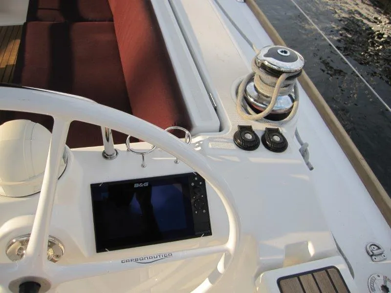 Slide: The Image of Cockpit view of 2015 Beneteau Oceanis 45 sailboat with navigation equipment and winch. - 34