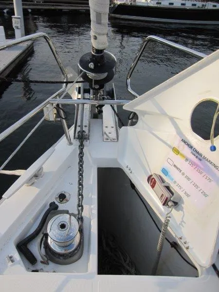Slide: The Image of Bow of 2015 Beneteau Oceanis 45 sailboat with anchor chain and winch. - 38