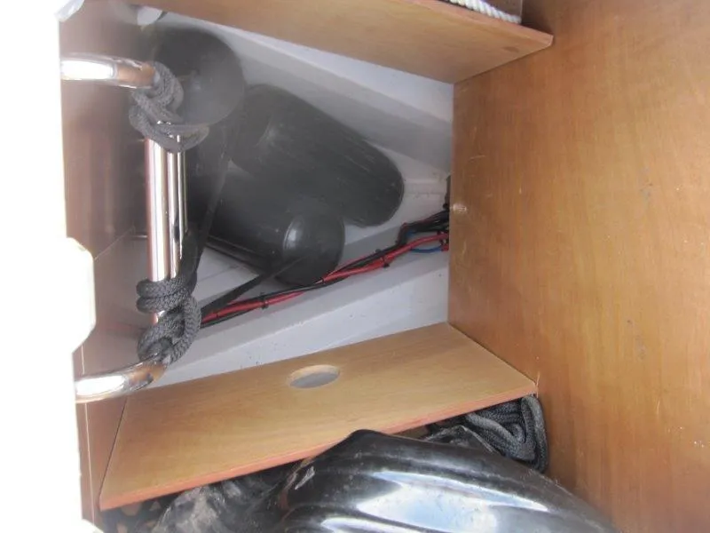 Slide: The Image of Storage compartment in a 2015 Beneteau Oceanis 45 sailboat, featuring ropes and fenders. - 39