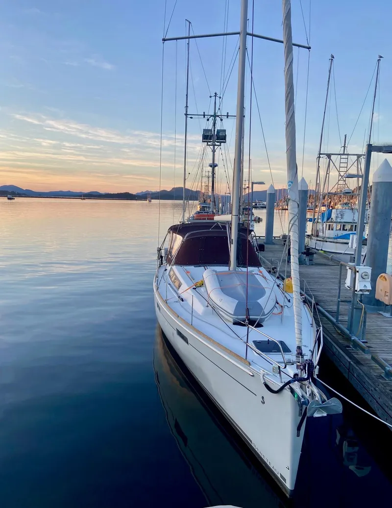 Slide: The Image of 2015 Beneteau Oceanis 45 sailboat docked at sunset. - 48
