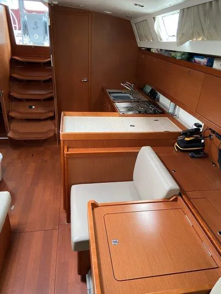 Slide: The Image of Interior of 2015 Beneteau Oceanis 45 yacht with wooden cabinetry and modern kitchen. - 5