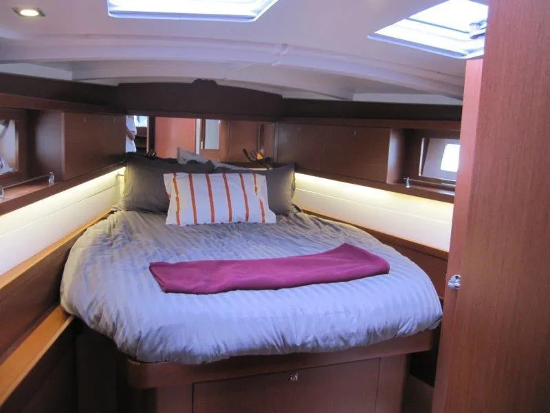 Slide: The Image of Luxurious cabin interior of 2015 Beneteau Oceanis 45 yacht with cozy bedding. - 6