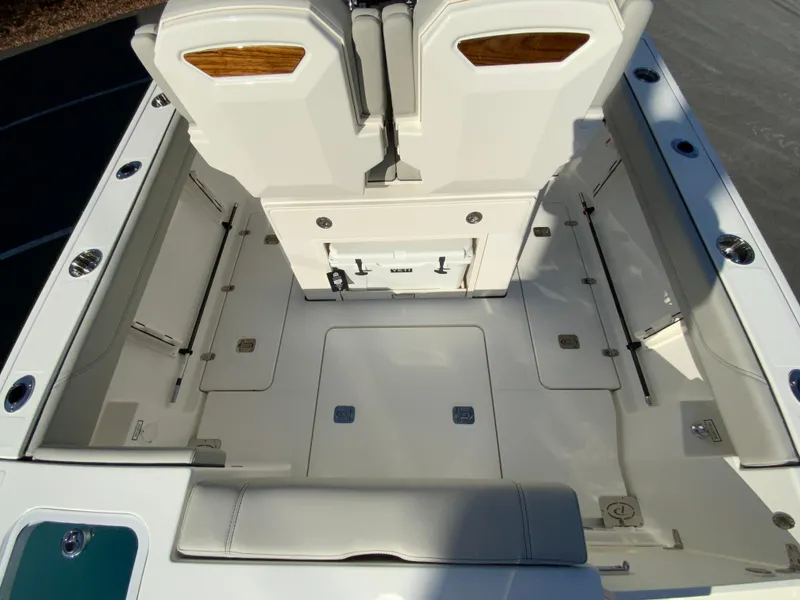 Slide: The Image of 2025 Pursuit S 248 Sport boat interior with spacious seating and storage. - 11
