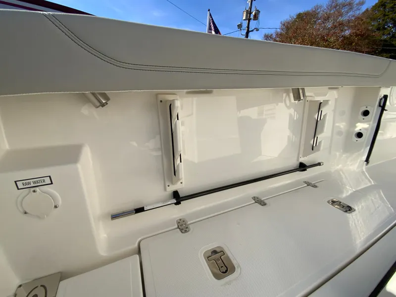 Slide: The Image of 2025 Pursuit S 248 Sport boat interior with storage compartments and clean design. - 13