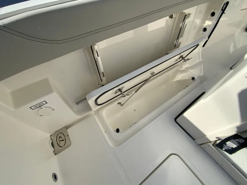 Slide: The Image of 2025 Pursuit S 248 Sport boat interior storage compartment. - 15