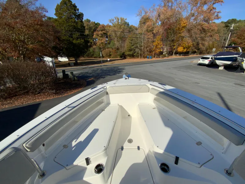Slide: The Image of 2025 Pursuit S 248 Sport boat on trailer, surrounded by autumn trees. - 33