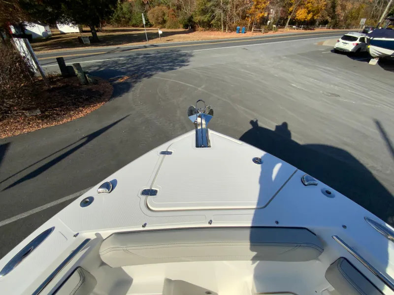 Slide: The Image of 2025 Pursuit S 248 Sport boat parked on a sunny day. - 34