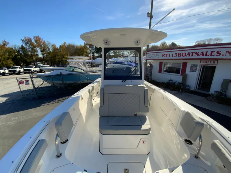 Slide: The Image of 2025 Pursuit S 248 Sport boat at dealership, front view. - 35