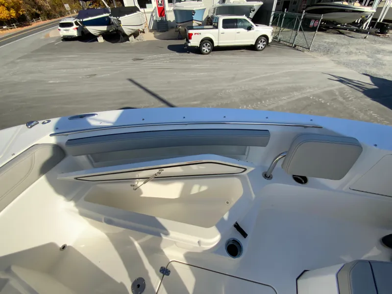 Slide: The Image of 2025 Pursuit S 248 Sport boat interior with seating and storage compartments. - 38
