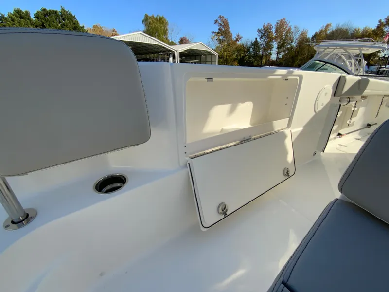 Slide: The Image of 2025 Pursuit S 248 Sport boat interior with open storage compartment. - 41