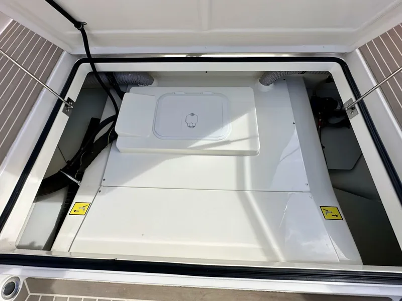 Slide: The Image of Engine compartment of 2022 Nimbus T8 boat, featuring a clean, organized layout. - 22