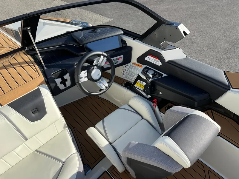 Slide: The Image of 2024 Nautique Ski Nautique boat interior with modern dashboard and seating. - 16