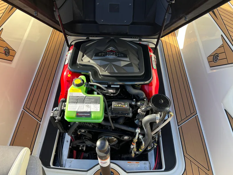 Slide: The Image of 2024 Nautique Ski Nautique engine compartment with detailed components and sleek design. - 19