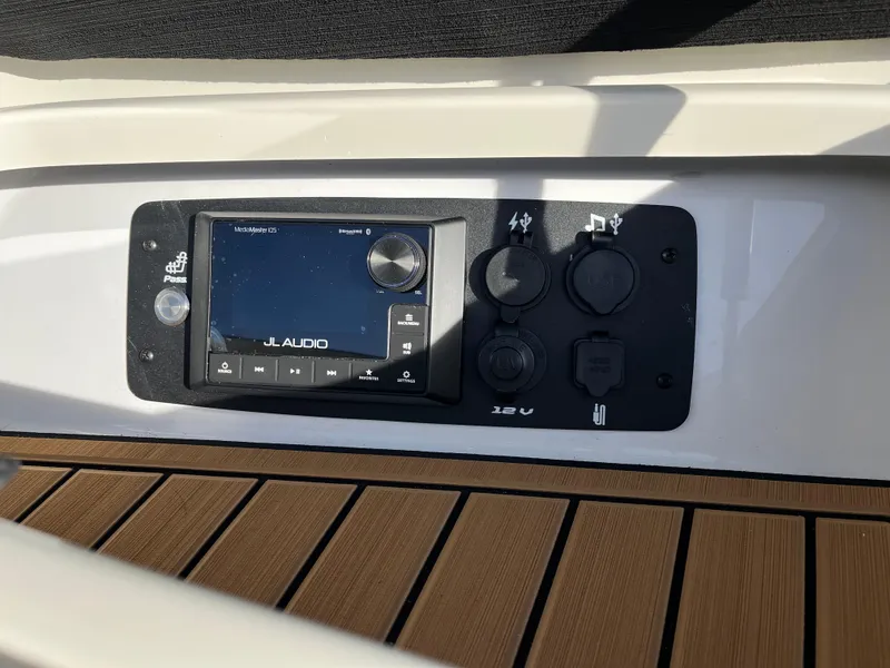 Slide: The Image of 2024 Nautique Ski Nautique audio system with JL Audio controls and USB ports. - 20