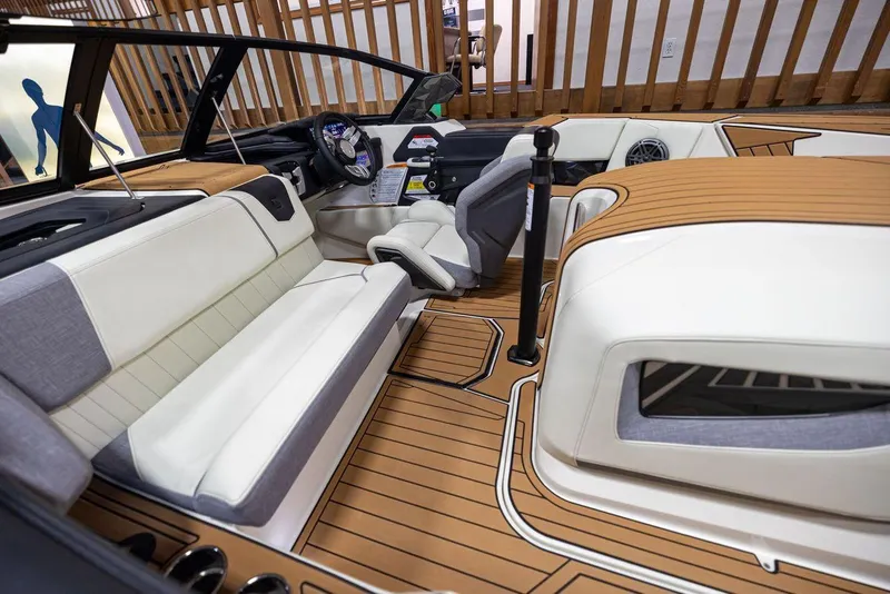 Slide: The Image of 2024 Nautique Ski Nautique interior with luxurious seating and modern dashboard design. - 8