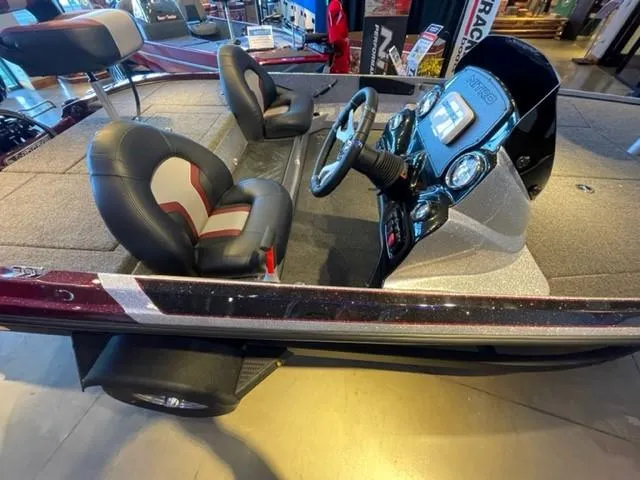 Slide: The Image of 2025 Nitro Z17 boat interior with steering console and cushioned seats. - 3