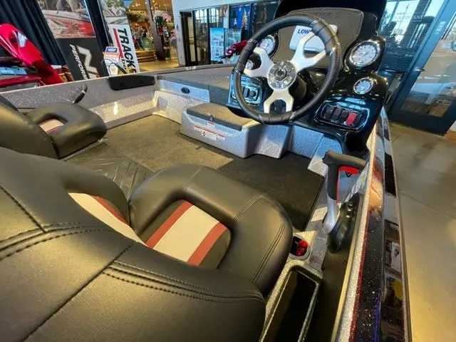 Slide: The Image of 2025 Nitro Z17 boat interior with steering wheel and seats. - 5