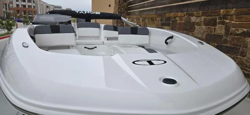 Slide: The Image of 2025 Tahoe T18 boat with sleek white design and comfortable seating. - 3