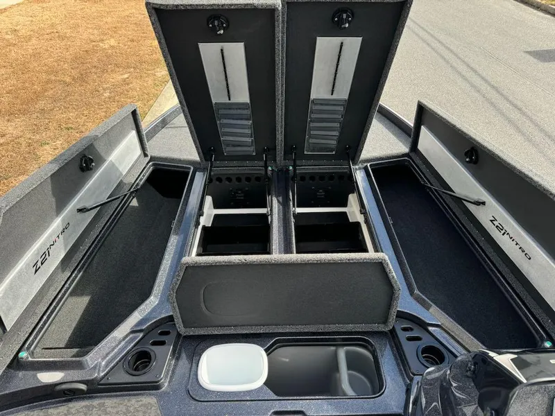 Slide: The Image of 2025 Nitro Z21 XL boat storage compartments open, showcasing spacious interior design. - 11