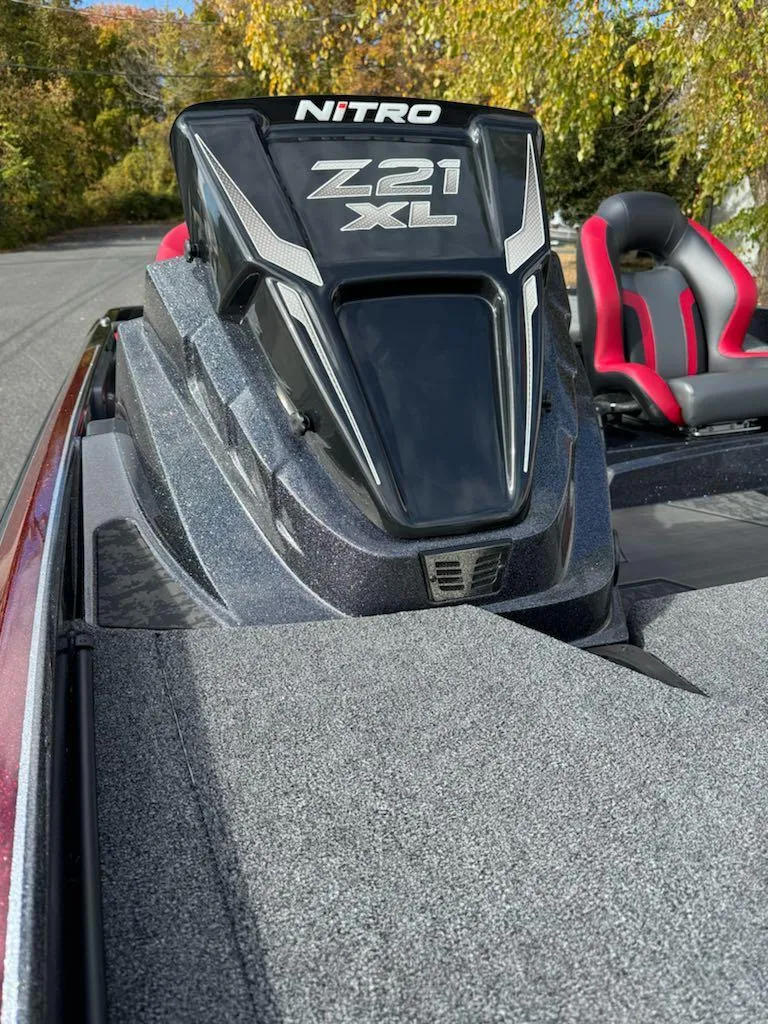 Slide: The Image of 2025 Nitro Z21 XL boat with sleek design and red-accented seats. - 12
