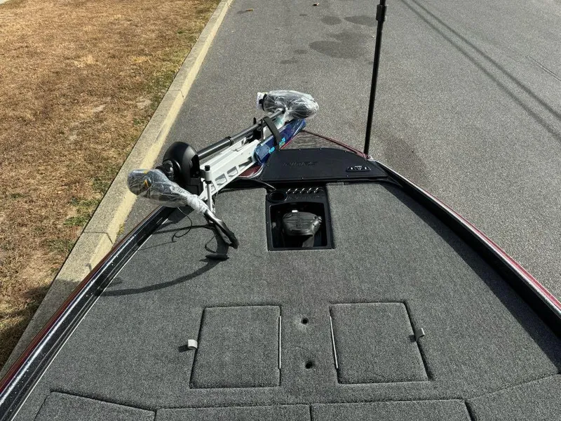 Slide: The Image of 2025 Nitro Z21 XL boat deck with trolling motor and storage compartments. - 15