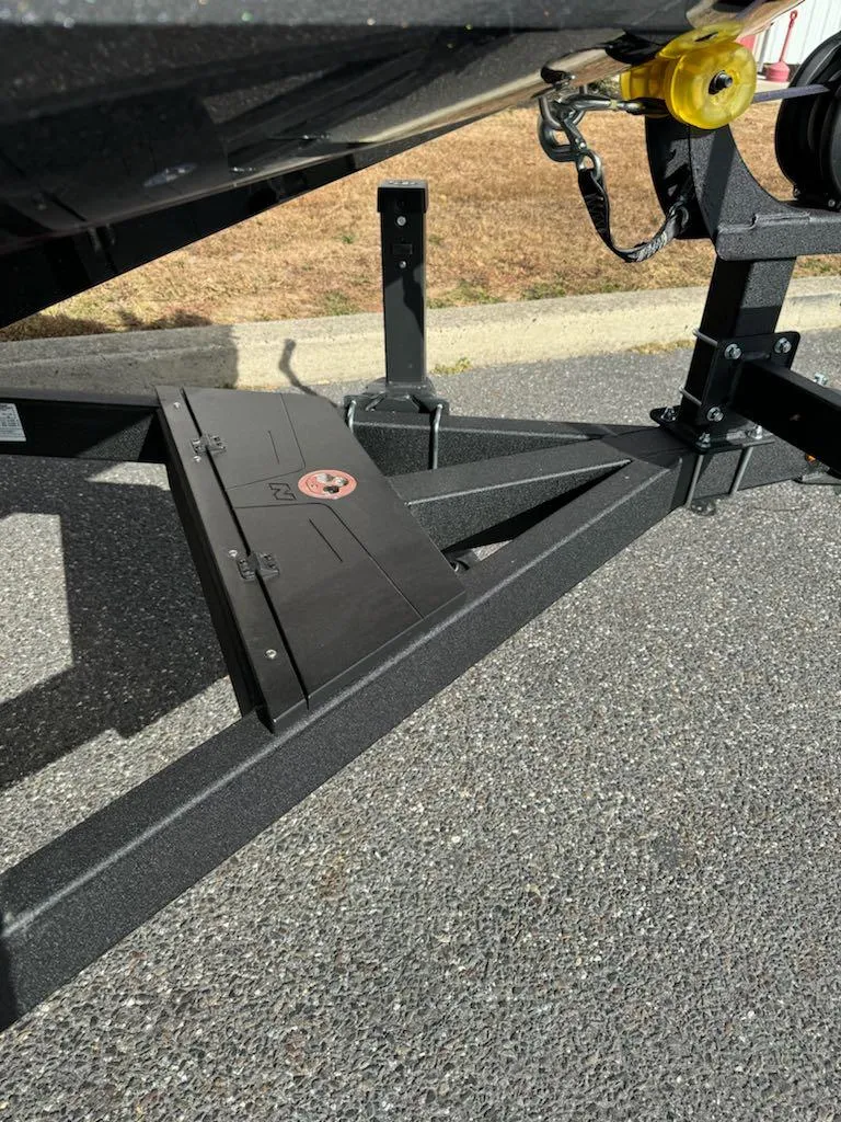 Slide: The Image of 2025 Nitro Z21 XL boat trailer detail on asphalt surface. - 16