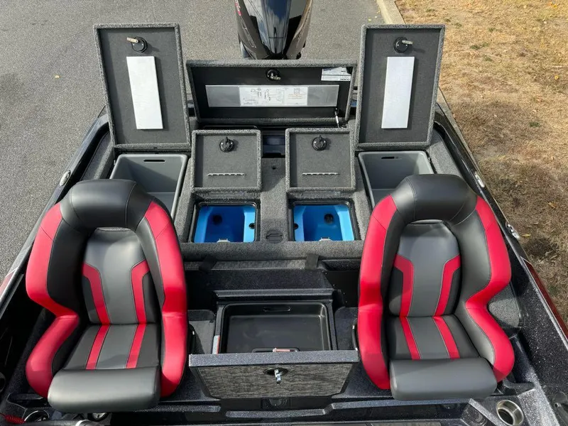 Slide: The Image of 2025 Nitro Z21 XL boat interior with red and black seats, storage compartments, and livewells. - 4