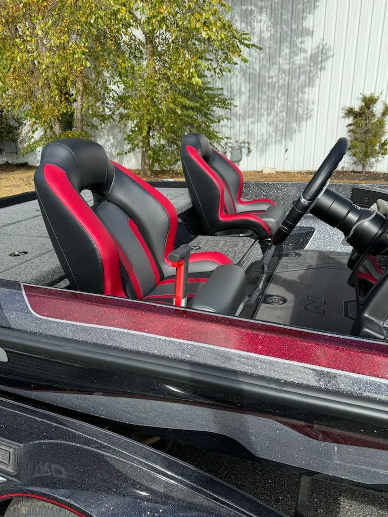 Slide: The Image of 2025 Nitro Z21 XL boat interior with red and black seats. - 6