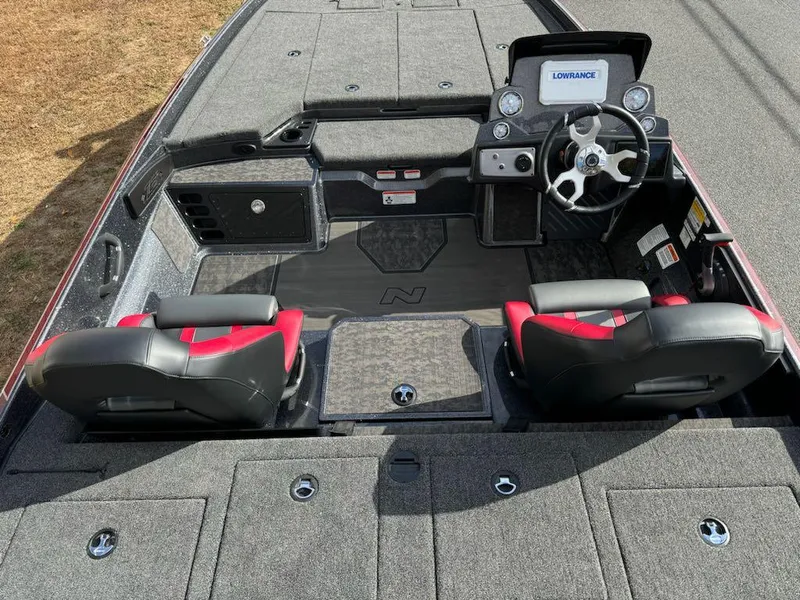 Slide: The Image of 2025 Nitro Z21 XL boat interior with dual seats and advanced dashboard. - 7
