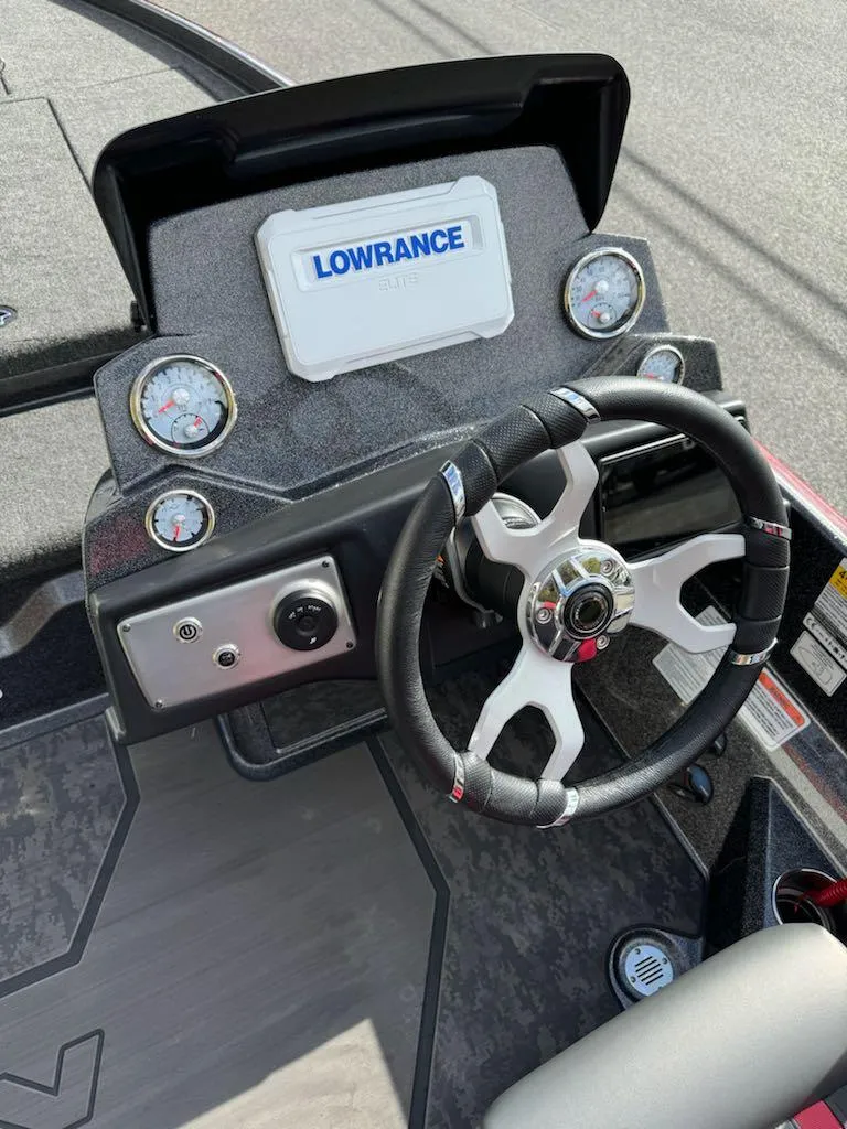 Slide: The Image of 2025 Nitro Z21 XL boat dashboard with Lowrance display and steering wheel. - 9