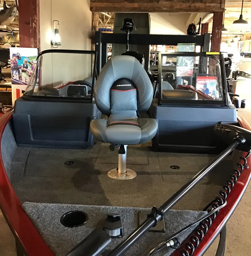 Slide: The Image of 2025 Tracker Pro Guide V-175 Combo boat interior with seating and controls. - 2