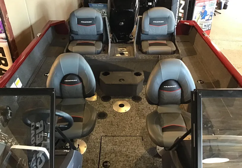 Slide: The Image of 2025 Tracker Pro Guide V-175 Combo boat interior with four seats and steering console. - 4