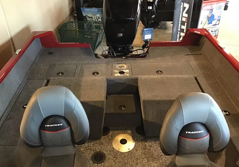 Slide: The Image of 2025 Tracker Pro Guide V-175 Combo boat interior with seating and motor. - 5