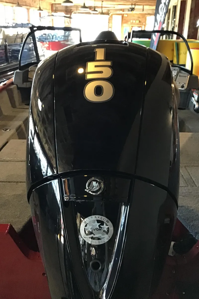 Slide: The Image of 2025 Tracker Pro Guide V-175 Combo boat engine, 150 horsepower, in a showroom setting. - 6