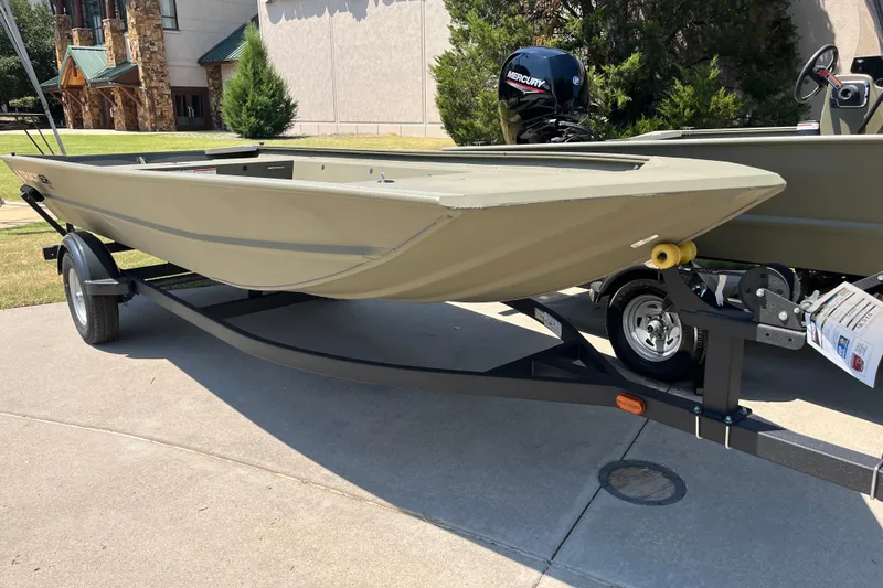 The Image of 2025 Tracker Grizzly 1754 Jon boat on trailer, displayed outdoors. - 0